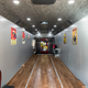 Image for article titled An Old, Neglected Coach Bus Was Turned Into A Classy Car Hauler